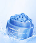 Blue jar of Medicube hydrating cream with capsules on a light blue background