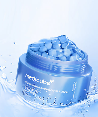 Blue jar of Medicube hydrating cream with capsules on a light blue background