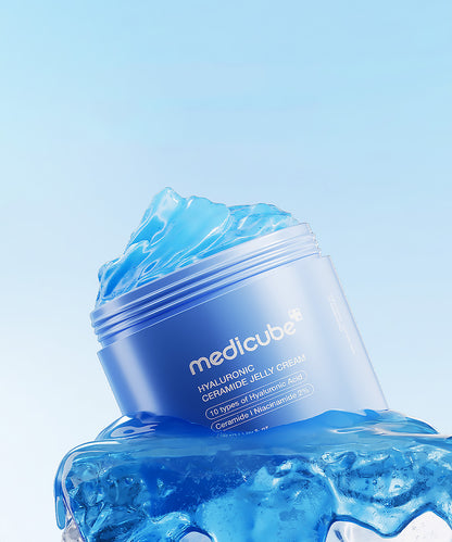 Blue jar of Medicube cream with blue jelly-like substance on a light blue background