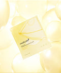 Medicube sheet mask packaging with yellow balloons in the background
