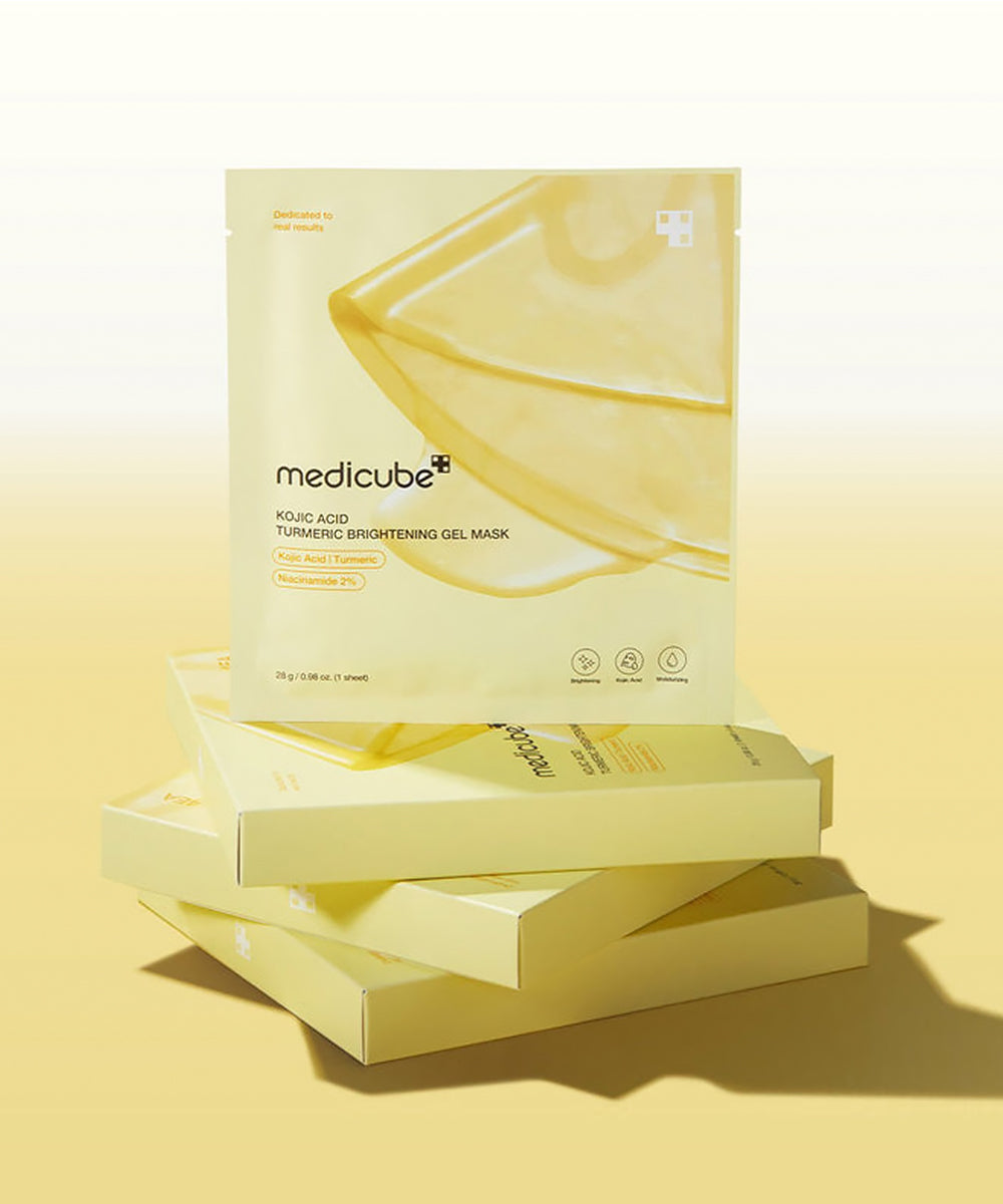 Stack of medicube gel mask boxes on a yellow background