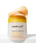 Medicube Kojic Acid Turmeric Pad container with yellow lid on a white background