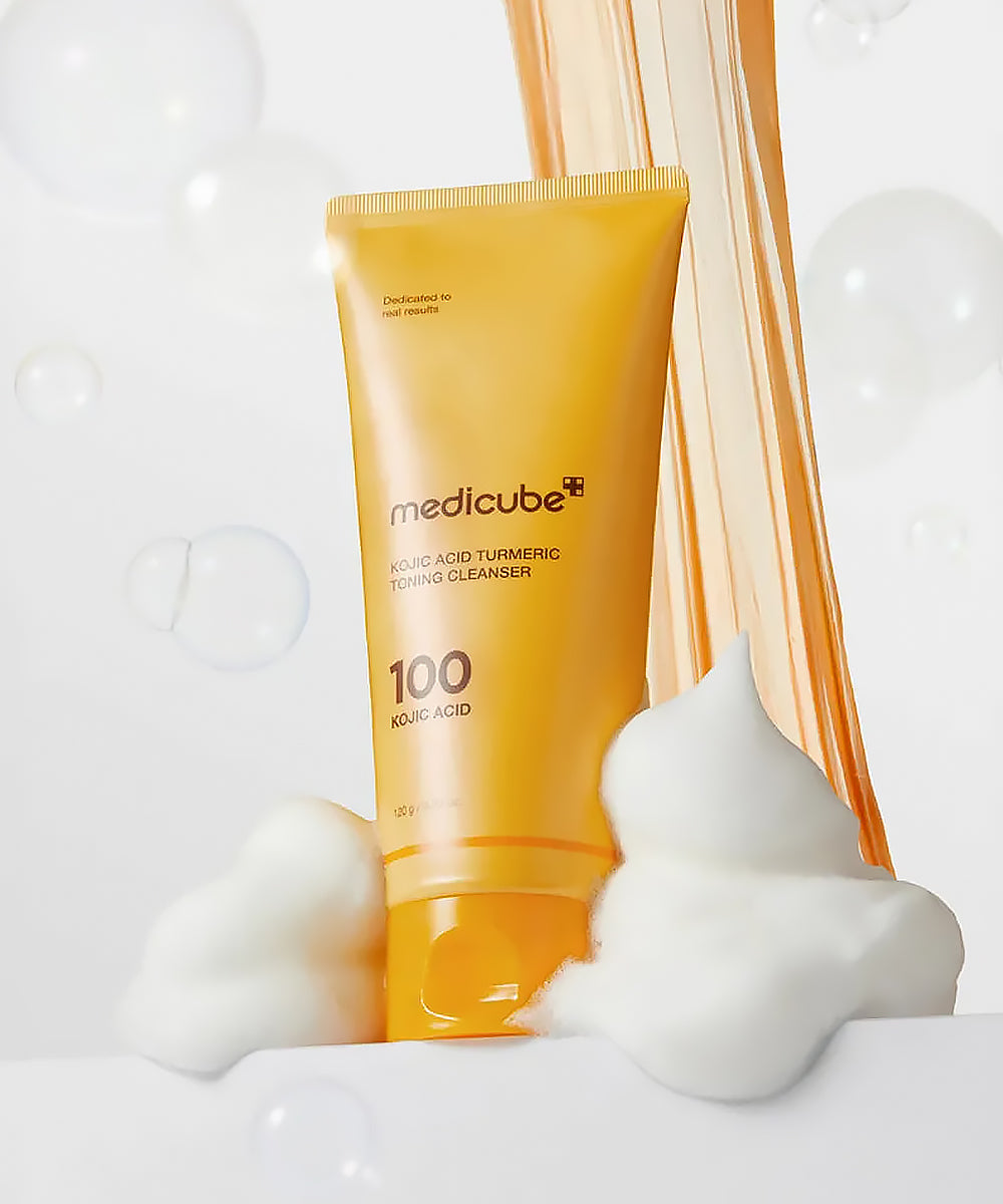 Medicube cleanser bottle with foam on a light background