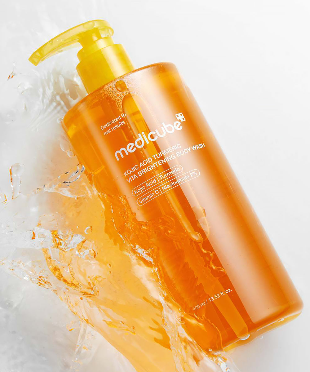 Orange bottle of Medicated Body Wash with water splash on a white background