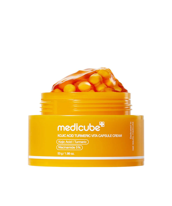 Yellow jar of Medicube cream with capsules on a white background