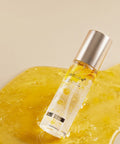 Skincare serum bottle with a yellow textured background