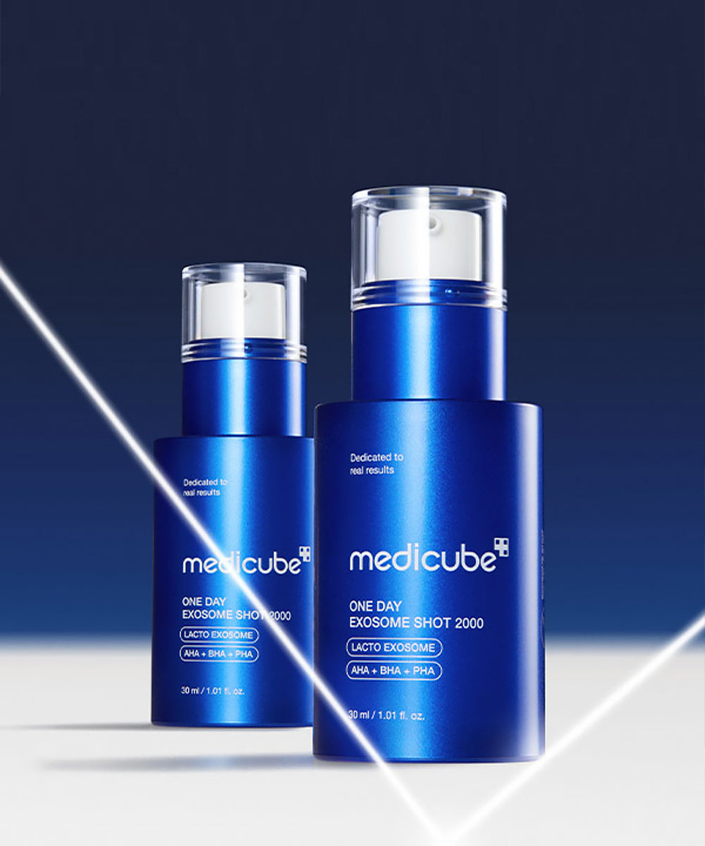 Two blue skincare bottles with 'medicube' branding on a dark background
