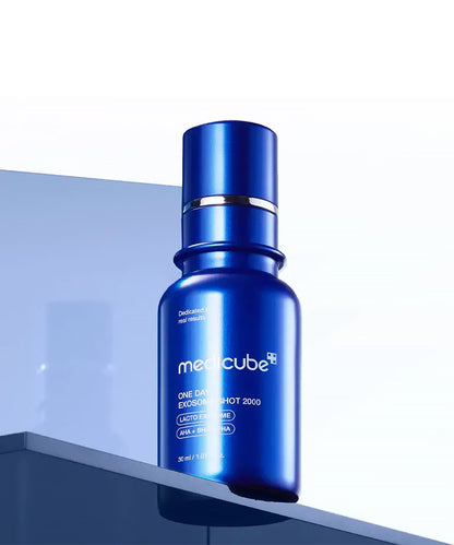 Blue serum bottle with 'medicube' branding on a light blue background