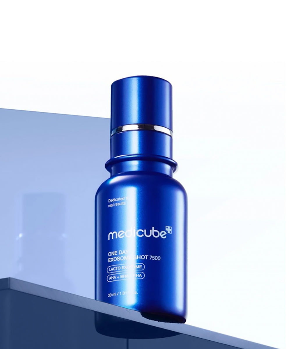Blue skincare serum bottle with 'medcube' branding on a reflective surface.