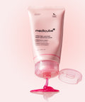 Pink skincare product with Medicube branding on a white background