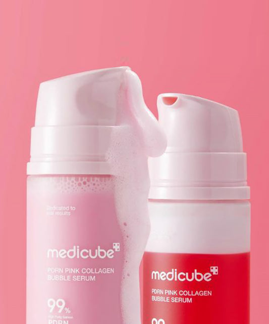 Two bottles of Medicube Pink Collagen Bubble Serum on a pink background