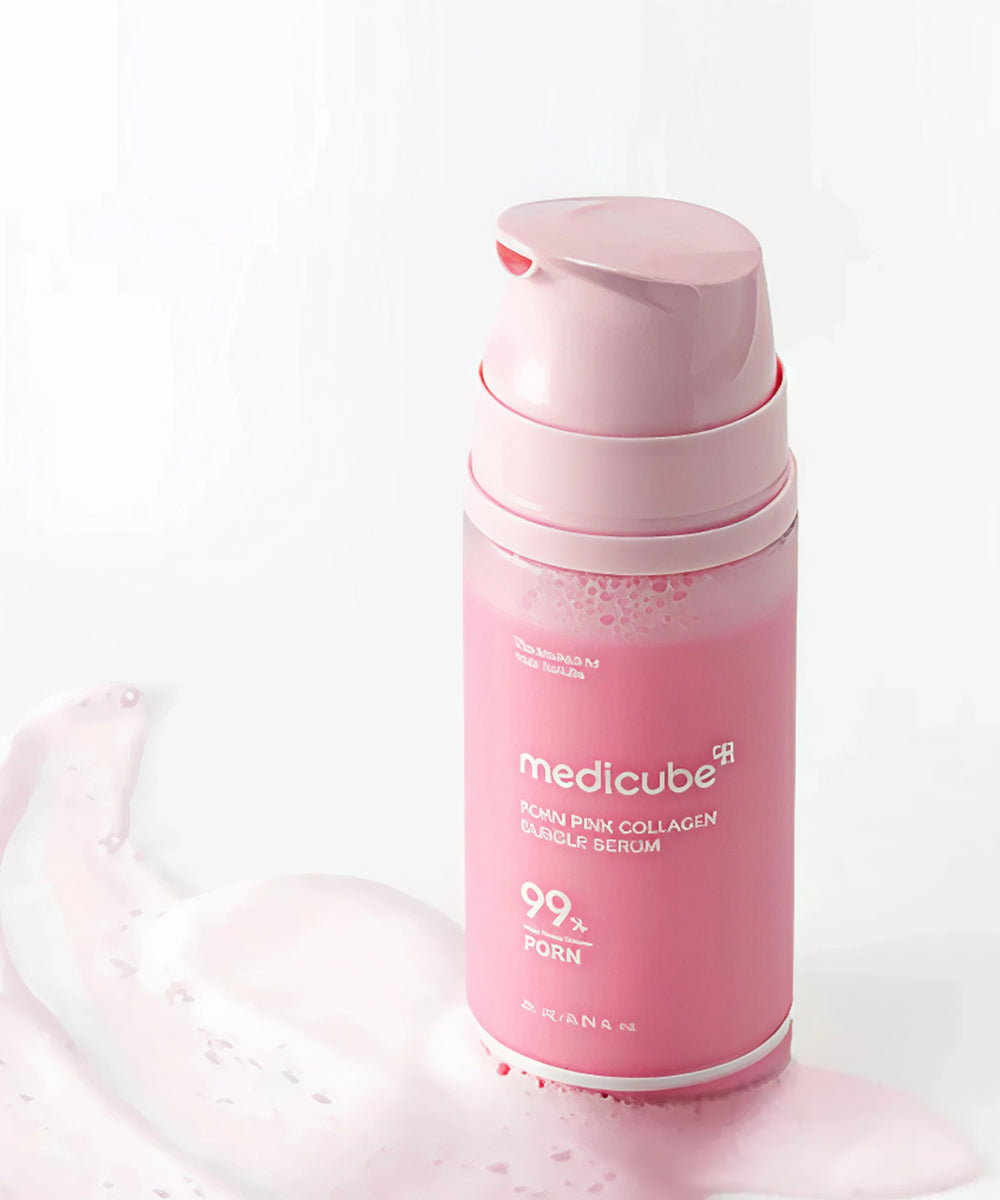 Pink skincare serum bottle with visible brand name on a white background