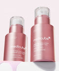 Side-by-side comparison of the Medicube PDRN Pink Collagen Exosome Shot 2000 and 7500 bottles, showcasing the metallic pink packaging and dripping pink serum texture