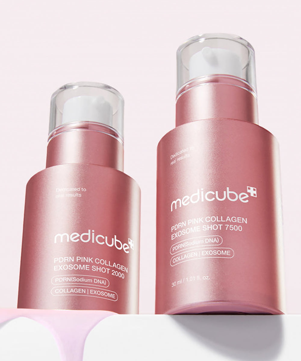 Side-by-side comparison of the Medicube PDRN Pink Collagen Exosome Shot 2000 and 7500 bottles, showcasing the metallic pink packaging and dripping pink serum texture