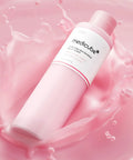 Pink skincare bottle with 'medicube' branding on a pink background