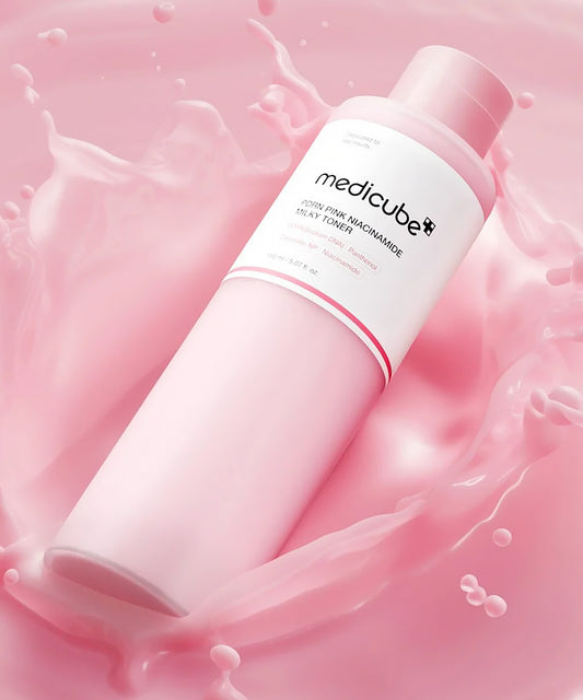 Pink skincare bottle with 'medicube' branding on a pink background