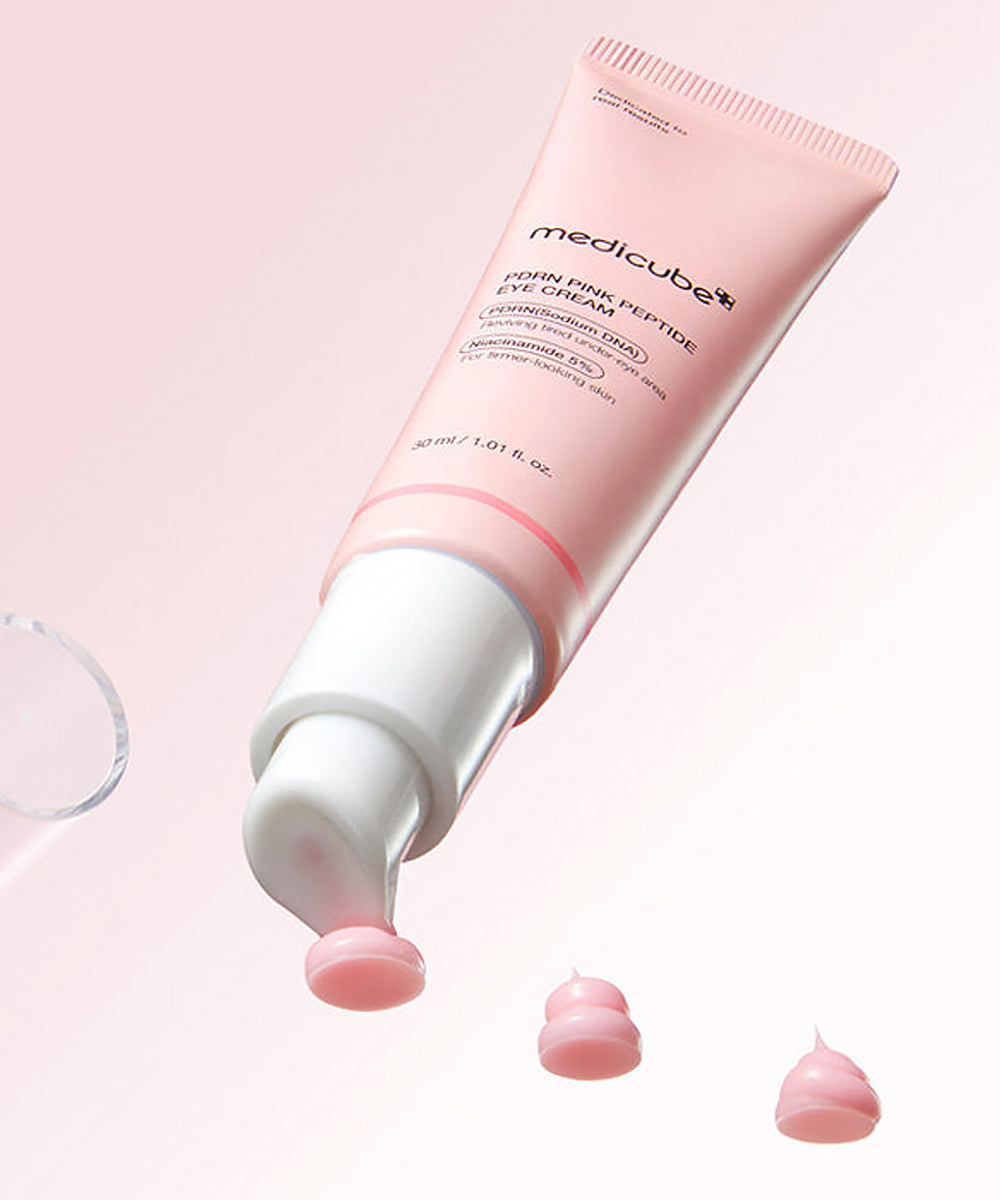 Pink skincare product with visible brand name on a light pink background