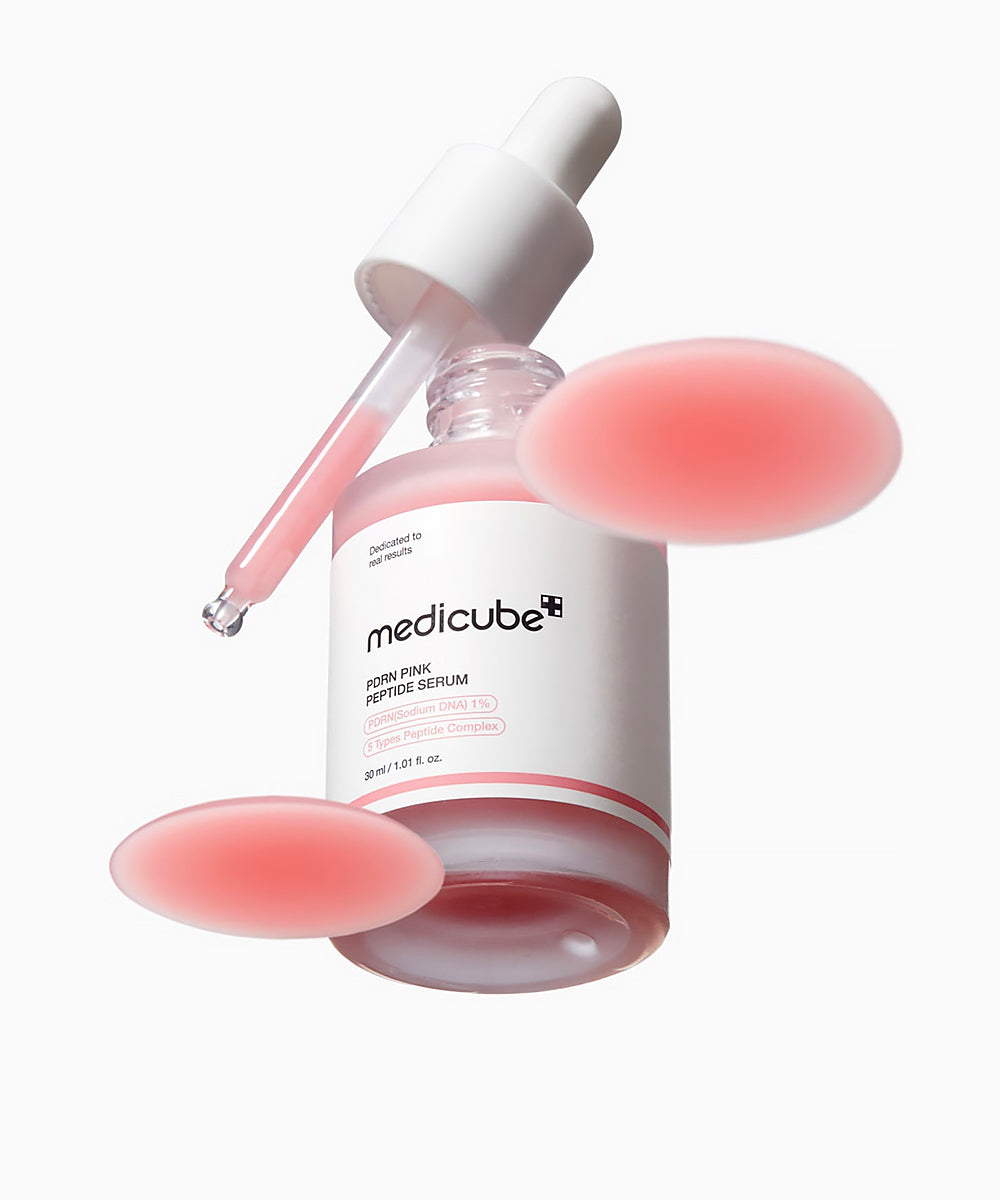 Medicube serum bottle with dropper on a white background