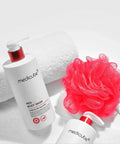 Medicube Red Body Wash bottle with a red loofah on a white background
