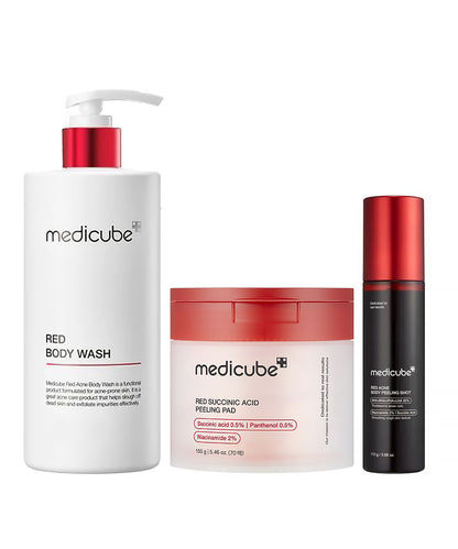 A professional group shot of the Medicube Red skincare line, featuring the Red Body Wash, the Red Succinic Acid Peeling Pad jar, and the Red Acne Body Peeling Shot bottle on a white background