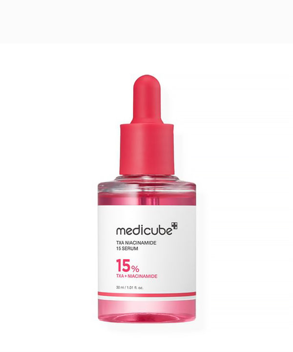 Medicube TXA Niacinamide 15 Serum bottle with pink cap on a white background