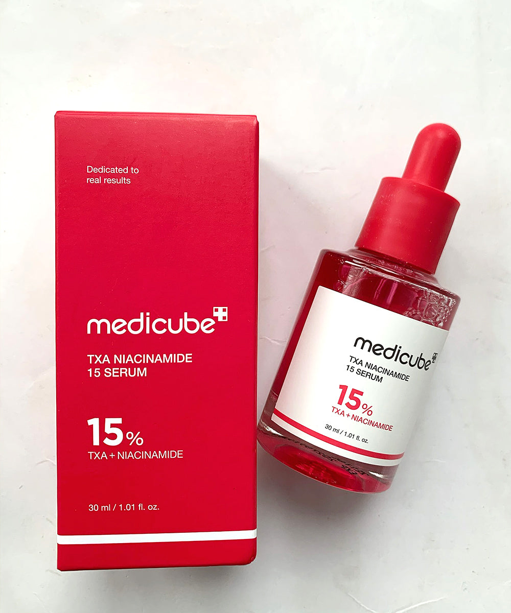 Medicube TXA Niacinamide 15 Serum bottle and packaging on a white background