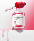 Medicube TXA Nicotinamide 15 Serum bottle with dropper on a pink background