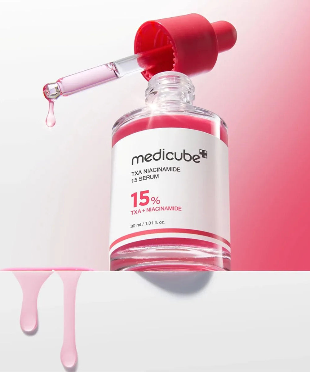 Medicube TXA Nicotinamide 15 Serum bottle with dropper on a pink background