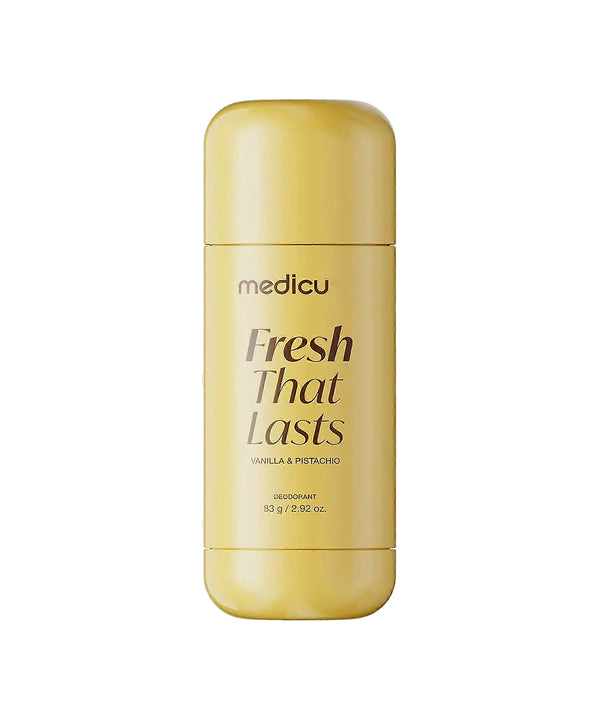 A gold deodorant stick by medicu, labeled 'Fresh That Lasts' in brown lettering, set against a plain white background.