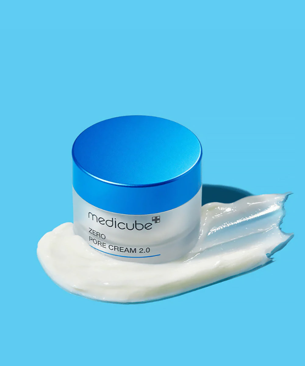 Jar of Medicube Zero Pore Cream 2.0 with blue lid on a blue background