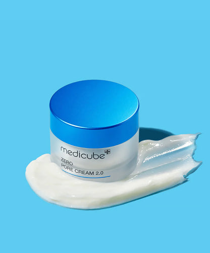 Jar of Medicube Zero Pore Cream 2.0 with blue lid on a blue background