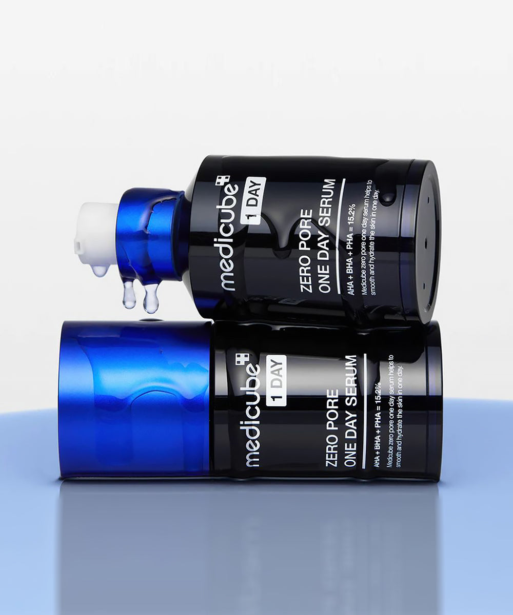 Two bottles of Medicube Zero Pore One Day Serum on a light gray background