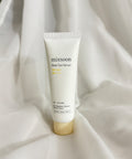 Tube of mixsoon Bean Sun Serum on a white fabric background