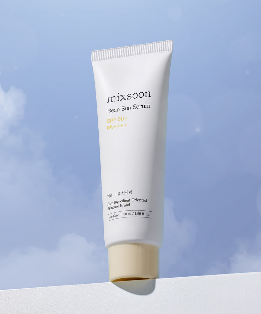 Tube of mixsoon Bean Sun Serum against a blue sky background
