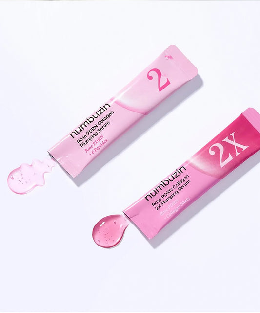 Close-up of the Numbuzin No.2 serum being dispensed, highlighting the silky, translucent pink liquid texture designed for deep hydration and skin elasticity
