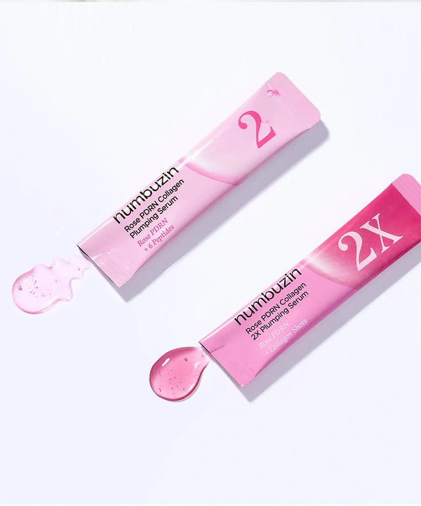 Close-up of the Numbuzin No.2 serum being dispensed, highlighting the silky, translucent pink liquid texture designed for deep hydration and skin elasticity