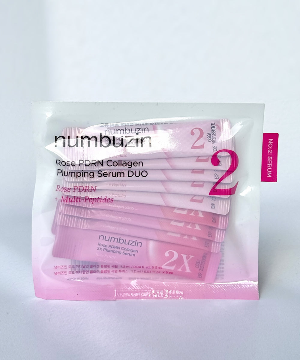 Lifestyle promotional image of the Numbuzin No.2 Serum Duo arranged elegantly on a clean background with soft floral accents, reflecting a premium "glass skin" aesthetic