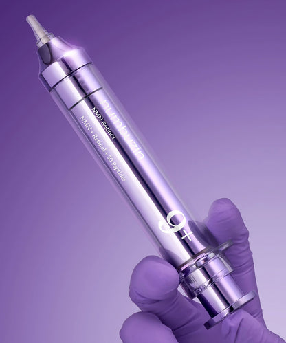 Purple medical device held by a gloved hand against a purple background