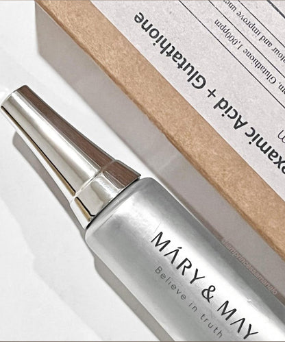 Silver bottle with 'MARY & MAY' branding against a beige box background