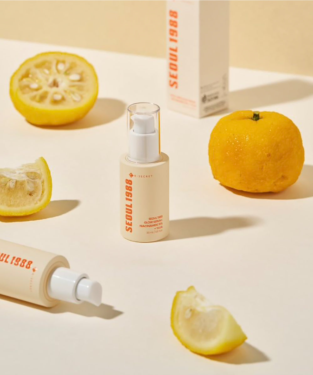 Skincare products with lemons on a light background