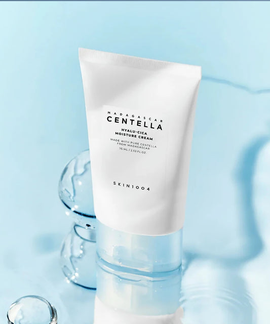 Skincare cream tube with 'Madagascan Centella' branding on a light blue background