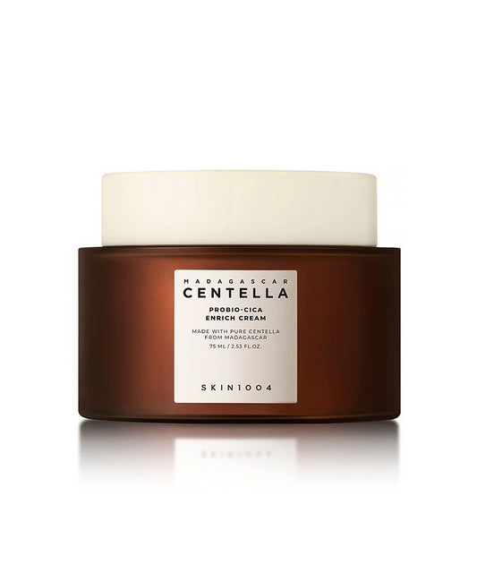 Brown jar of skincare cream with a white lid on a white background