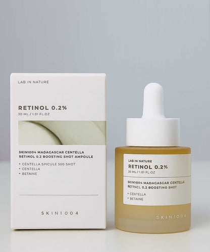Retinol serum bottle and packaging with 'Lab in Nature' branding on a gray background