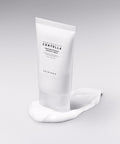 Skincare cream tube with visible brand name on a gray background