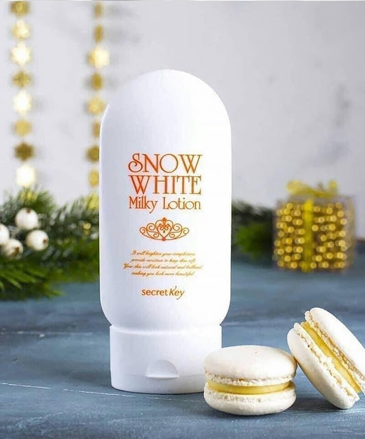 Snow White Milky Lotion bottle with macarons on a decorative background