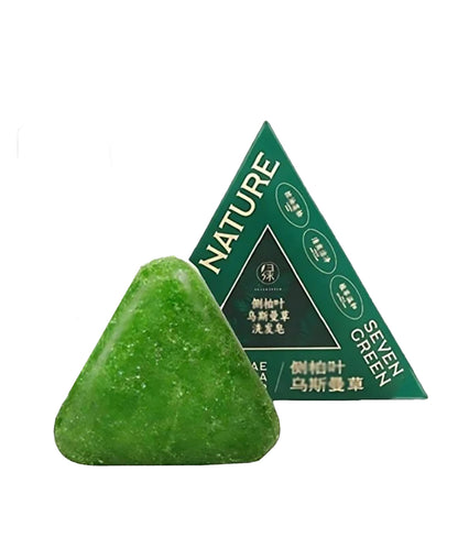 Triangular green soap bar with a green triangle-shaped packaging labeled 'Nature Seven Green' on a white background.