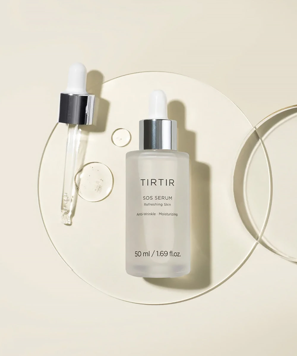TIRTIR SOS Serum bottle and dropper on a circular glass tray, showcasing clear, hydrating serum droplets against a neutral beige background