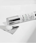 Skincare serum bottle with dropper on a white background