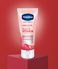 Vaseline Gluta Vitamin serum tube on a red background