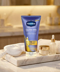 Vaseline Gluta-Hya skincare product on a marble tray with a blurred bathroom background